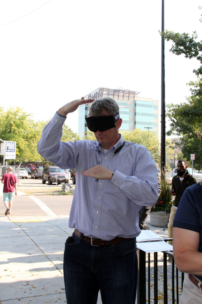 Witness trying on blindfold - Jay Larsen
